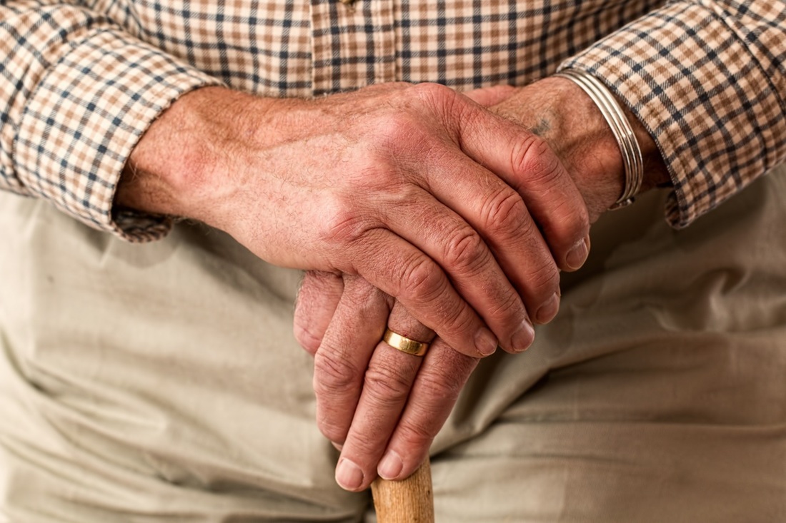 Elderly man with cane